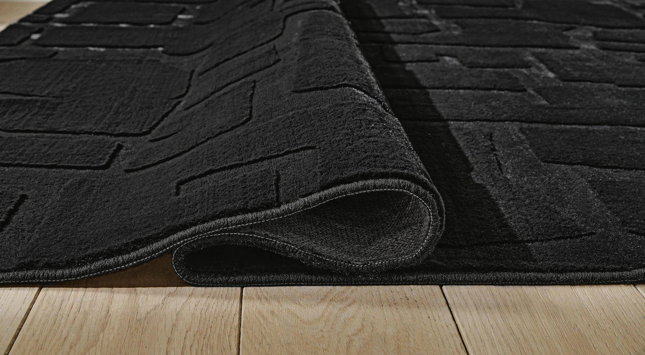 Gibbswell Washable 5' x 7' Area Rug - Dream Home Furniture & Mattress (Waite Park, MN)
